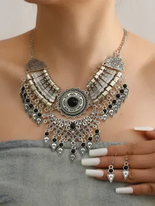 Vintage ethnic silver statement necklace and earrings set with black stones for women.