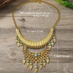 Vintage Boho Gold Statement Halskette mit Türkis Steinen und funkelnden Strass Fransen.