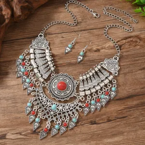 Vintage ethnic bohemian statement necklace and earrings set with vibrant turquoise beads.