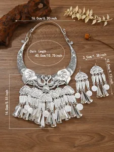 Parure de bijoux style ethnique argenté collier éléphant et boucles d'oreilles cloches.
