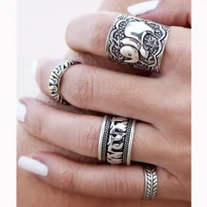 Vintage silver-plated multi-ring set featuring carved elephant and tribal boho geometric patterns.