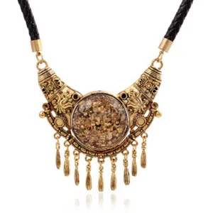 Vintage alloy statement necklace with black leather cord and gold glitter pendant drops.