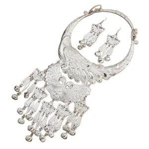 Traditional Miao silver peacock collar necklace and tassel earrings set for ethnic dance fashion.