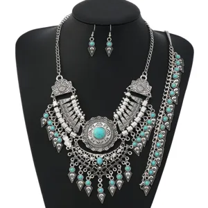 Detail view of vintage ethnic style turquoise necklace and earring set, bohemian jewelry.