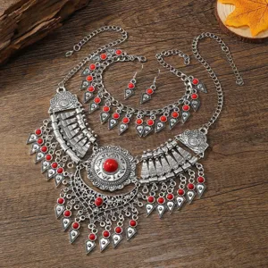 Detailed view of retro bohemian ethnic style statement necklace and earrings jewelry set.