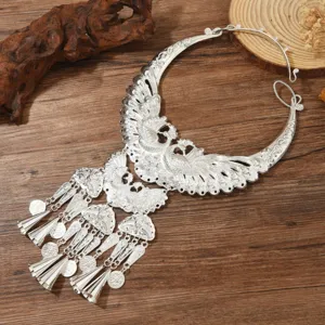 Traditional ethnic silver collar necklace with peacock and tassel design for stage wear.