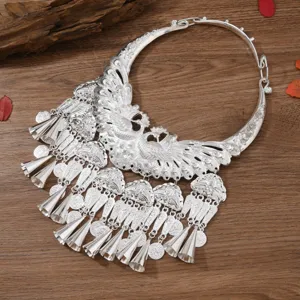 Miao ethnic peacock silver collar necklace with bells and tassels for cultural events and parties.