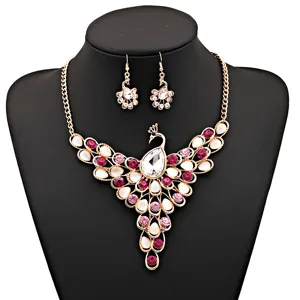 Exquisite peacock jewelry set featuring stunning pink rhinestones and gold-tone alloy for women.