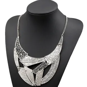 Detailed view of vintage punk style geometric cutout layered necklace statement jewelry.