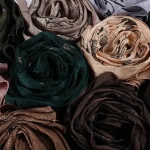 Elegant printed imitation silk long scarf featuring delicate leaf patterns. Soft and versatile.