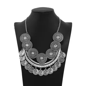 Detailed view of the vintage silver coin statement necklace, intricate multi-layer chain design.