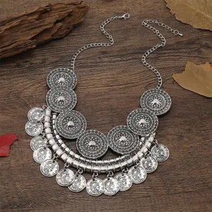 Detailed shot of vintage multi-layer coin necklace, bohemian style alloy jewelry accessory.