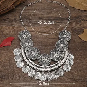 Detailed shot of vintage style multi-layer coin choker necklace, antique silver finish, closeup.