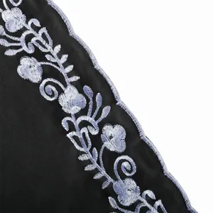 Black chiffon scarf detail, featuring delicate light blue floral embroidery edge.