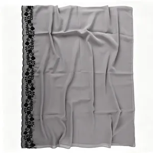 Grey chiffon scarf with black embroidered floral lace border, lightweight and breathable.