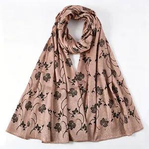 Close up detail of the pink imitation silk long scarf featuring elegant black floral print.