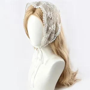 White lace triangular headscarf featuring delicate floral embroidery and ribbon ties, elegant hair accessory.