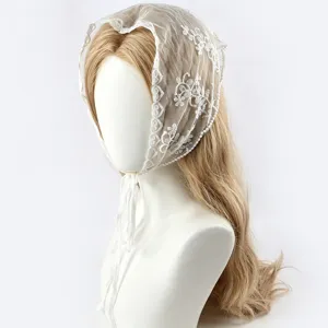 White lace triangular headscarf with floral embroidery for elegant women and fashion styling.