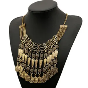 Vintage gold tone multi-layer coin tassel necklace detail view, bohemian statement jewelry.