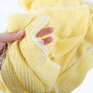 Yellow crinkle lace scarf detail view, lightweight breathable cotton linen feel hijab.