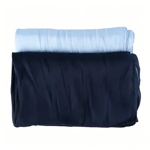 Detailed view of the breathable crinkled long scarf in light blue and navy color options.