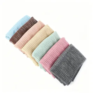 Detailed view of elastic metallic pleated hijab headscarf set in assorted vibrant colors.