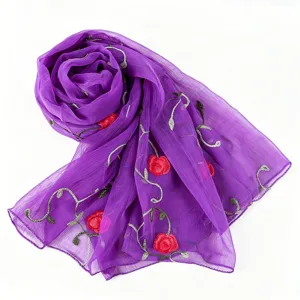 Purple chiffon scarf detail showing exquisite red flower and green vine embroidery patterns.