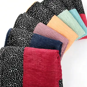 Pleated long headscarf detail view, showcasing soft crinkle texture and black polka dot design.