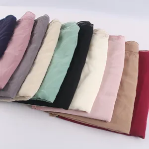 Detailed view of multi-color chiffon embroidered scarves, featuring delicate lace trim and soft fabric.