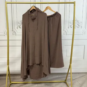 Brown Muslim prayer dress set detail, solid color pleated fabric with integrated hijab hood.