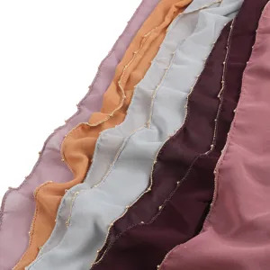 Close-up detail of soft chiffon hijab scarf featuring elegant gold bead trim in multi colors.
