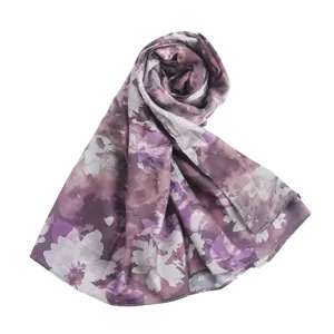 Detailed view of the elegant purple floral printed silk scarf showing fine patterns.