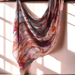 Close-up detail of the abstract watercolor printed scarf, lightweight fabric texture, elegant drape.