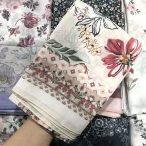 Detail shot of floral printed voile square scarf, soft fabric texture and elegant floral border.
