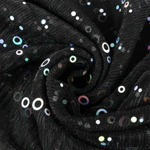 Close up detail of black shimmering metallic sequin fabric, breathable texture for scarf.