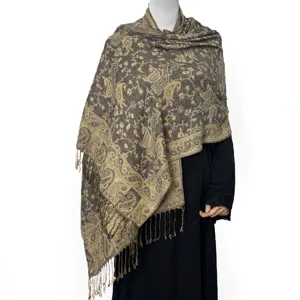 Detailed close-up view of the elegant jacquard paisley pattern shawl featuring delicate fringe tassels.