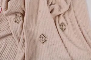 Close-up detail view of breathable solid mercerized cotton hijab shawl with stylish rhinestones.