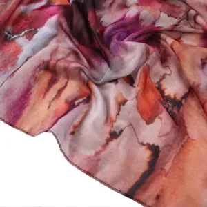 Vibrant abstract tie-dye satin polyester long scarf, elegant draped fashion headscarf.