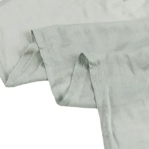 Close-up detail of soft modal cotton solid color sage green scarf fabric drape texture