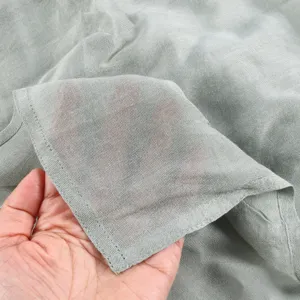 Detail shot of lightweight breathable solid color modal cotton scarf fabric texture.