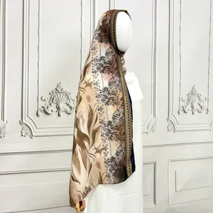Detailed view of long printed chiffon scarf with abstract ethnic and leopard patterns.