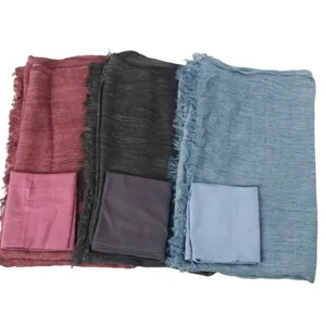 Detailed view of pleated rayon long scarf and matching elastic cap set in various colors.