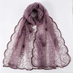 Detailed view of women's purple sheer embroidered floral scarf with delicate scalloped edges.