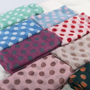 Detailed view of versatile French retro polka dot scarves in various colors with cotton linen feel.
