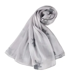 Detailed view of grey embroidered island silk scarf, elegant floral pattern for women daily wear.