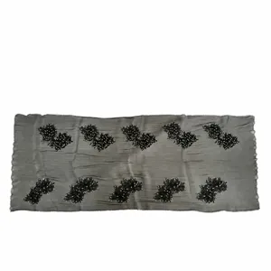 Black crinkled scarf with beaded floral embroidery, elegant shawl detail view for women.