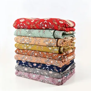 Pleated floral scarf detail showing soft textured fabric and vibrant multi-color stack.