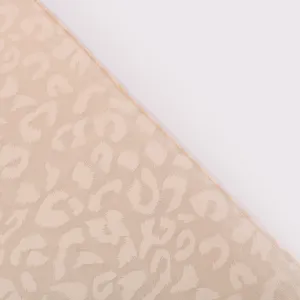 Exquisite chiffon leopard print scarf detail, lightweight fabric with gold foil finish.