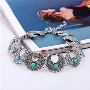 Vintage silver tone turquoise statement choker necklace, bohemian ethnic style jewelry accessory.