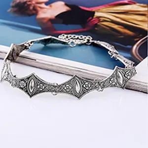 Vintage silver tone geometric carved choker necklace, elegant gothic statement jewelry item.